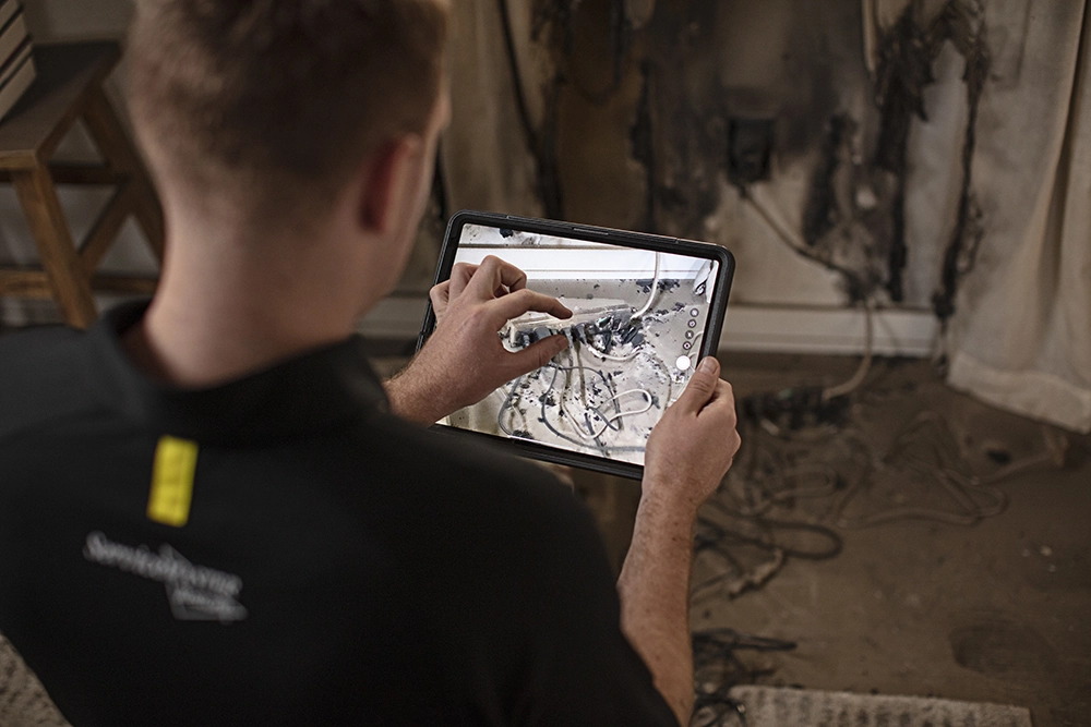 tech documenting fire damage
